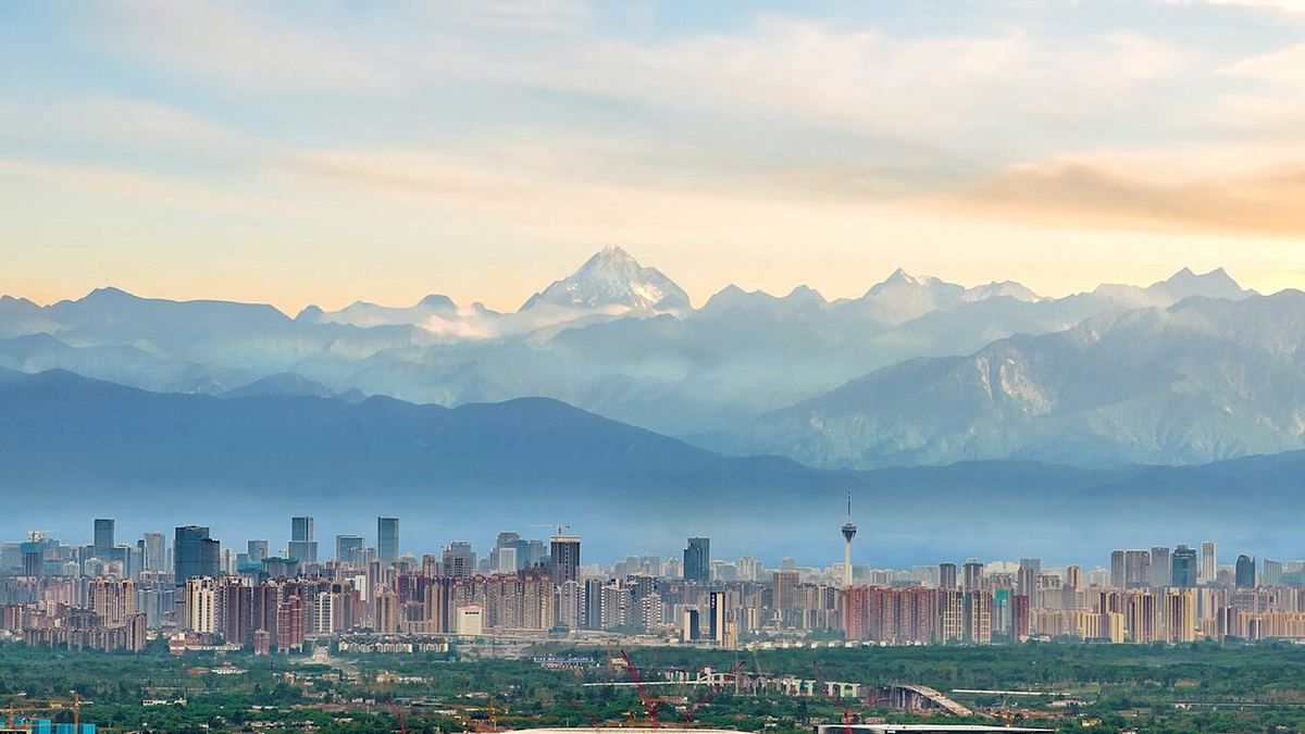 Chengdu skyline with snow-capped mountains