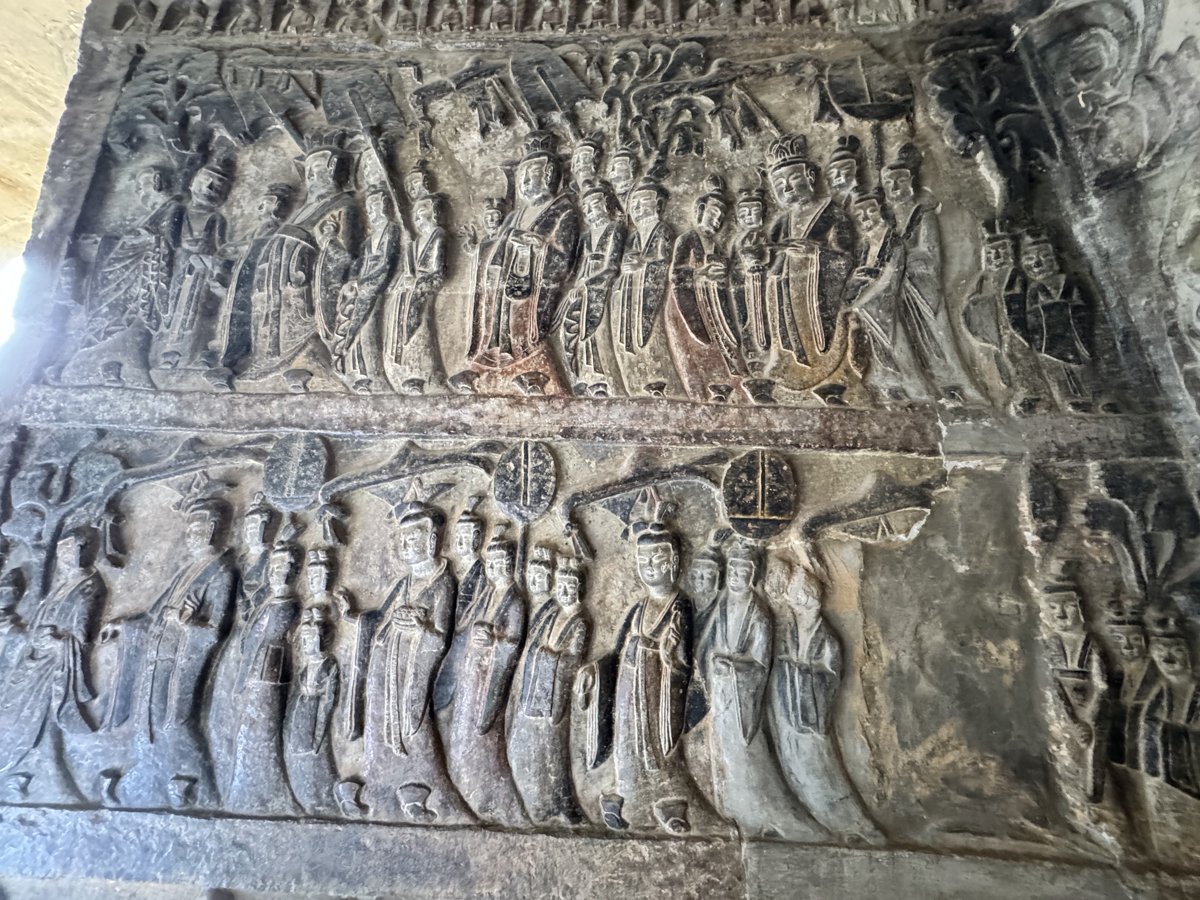 Relief of the emperor and empress worshipping the Buddha