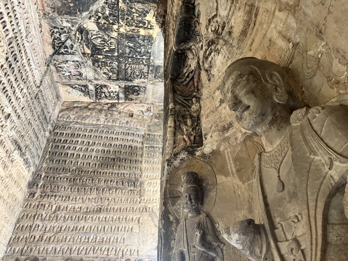 Small thousand-Buddha niches and figures inside a cave