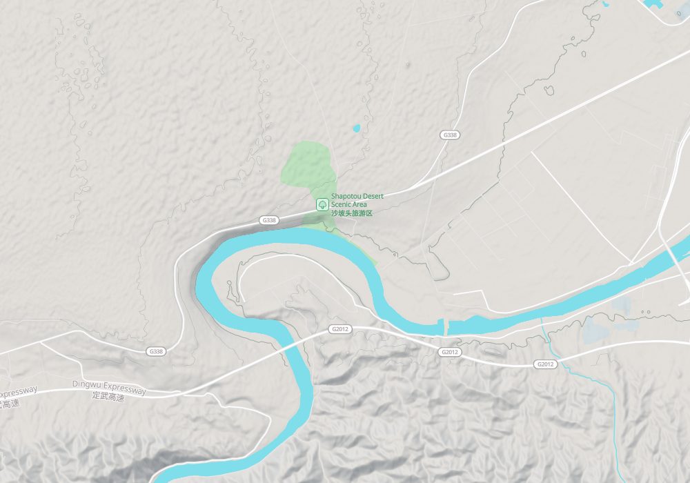 West of Zhongwei the Yellow River bends east; the Shapotou scenic area (green) is on the north bank with the Tengger Desert beyond; hillshade and 50 m contours